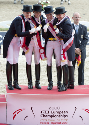 Pictured on the medal podium (L to R) are team-members Fabienne Lutkemeier, Kristina Sprehe, Helen Langehanenberg, Isabell Werth.