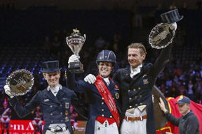 Great Britain’s Charlotte Dujardin (centre) claimed the Reem Acra FEI World Cup™ Dressage 2014 title at Lyon, France today after a spectacular Freestyle performance with Valegro. Pictured with her on the prize-winner’s podium are (left) runner-up Germany’s Helen Langehanenberg and (right) third-place Edward Gal from The Netherlands. Photo by FEI/Dirk Caremans