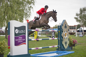 The Swiss team of Pius Schwizer, Romain Duguet, Paul Estermann and Steve Guerdat won the opening leg of the Furusiyya FEI Nations Cup™ Jumping Europe Division 1 series at Lummen, Belgium today without Olympic champion, Guerdat, having to jump a single fence. Pictured are Romain Duguet and Quorida de Treho who produced one of the three double-clear performances that clinched it for the Swiss side. Photo by FEI/Dirk Careman