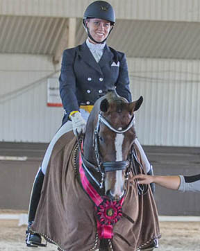 At the International Dressage Tournament CDI 3* Cedar Valley, held June 19-22, 2014 in Cedar Valley, ON, Canada's young dressage talent, Megan Lane, won both the Grand Prix and Grand Prix Special. Photo by Mary White, Lone Oak Equine Photography