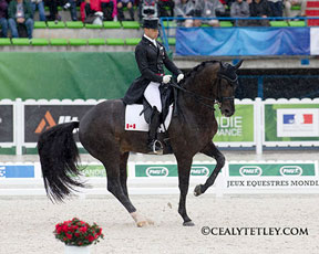 Despite having to ride in heavy rain, David Marcus of Campbellville, ON earned a score of 70.414% aboard Chrevi's Capital during day one of Dressage competition at the Alltech FEI World Equestrian Games on August 25 in Normandy, FRA. Photo by Cealy Tetley