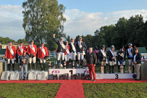 On the winner’s podium at the FEI European Jumping Championships for Veterans 2014 at Hoogboom-Kapellen in Belgium - (L to R) Team Germany (silver), Team Belgium (gold) and Team Great Britain (bronze). Photo by www.fotoagentur-Dill.de/FEI