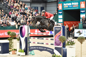 Hans-Dieter Dreher and Embassy ll won the ninth leg of the Longines FEI World Cup™ Jumping 2014/2015 Western European League series on home ground at Leipzig, Germany. Photo by FEI/Karl-Heinz Freiler