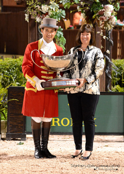 Carlene Ziegler accepts the Harrison Cup Perpetual Trophy on behalf of Artisan Farms at the 2015 Winter Equestrian Festival in Wellington, FL. Photo by Starting Gate Communications