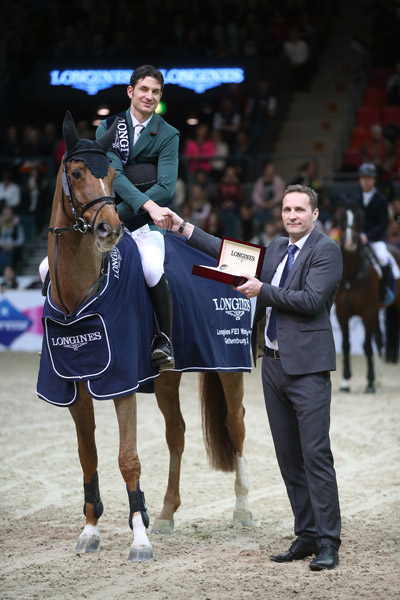 Olympic champion, Switzerland's Steve Guerdat, pictured with Casper Gebeke, Longines Sweden country manager, after winning the twelfth and final qualifying round of the Longines FEI World Cup™ Jumping 2014/2015 Western European League with the mare Albfuehren's Paille at Gothenburg, Sweden. FEI/Roland Thunholm