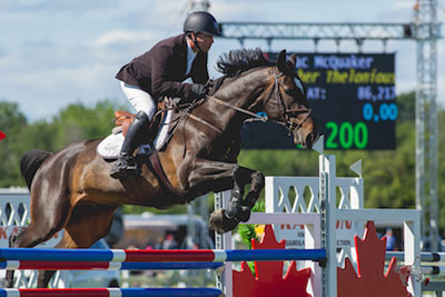 Mac McQuaker and Brother Thelonious on their way to victory in the $7,500 Lynn Millar Memorial Speed Derby at the Ottawa International Horse Show at Wesley Clover Parks. Photo by Ben Radvanyi Photography