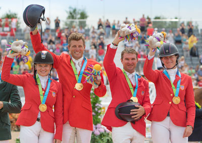 USA’s Marilyn Little, Boyd Martin, Phillip Dutton and Lauren Kieffer celebrate team Jumping gold at the Pan-American Games in Caledon Park, Toronto, Canada today. Little also claimed the individual title. Photo by FEI/StockImageServices.com