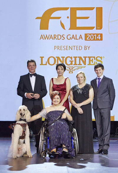 Equestrian heroes celebrated at the FEI Awards 2014, in association with Longines and with international fashion designer Reem Acra (left to right): Jeroen Dubbeldam (NED), Melissa Tan (SIN) chairman of equine therapy centre Equal Ark, Jackie Potts (GBR), Lambert Leclezio (MRI) with (centre) Sydney Collier (USA) and her service dog Journey. Photo by FEI/Liz Gregg