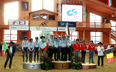 The Junior Team podium at the FEI European Reining Championships for Juniors and Young Riders 2015 at Givrins, Switzerland (L to R): the silver medallists from Italy, gold medallists from Germany and bronze medallists from Belgium. Photo by FEI/Andrea Bonaga