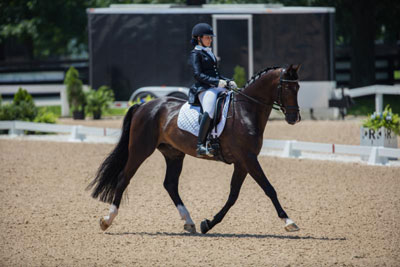 Madison Lawson of King City, ON rode as part of Canada's inaugural Para-Dressage Team at NAJYRC, scoring 66.815% in the Grade IV Team Test aboard Lawrence. Photo by StockImageServices.com