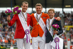 On the podium for today’s FEI European individual Jumping Final in Aachen, Germany: (L to R) Gregory Wathelet (BEL) silver, Jeroen Dubbeldam (NED) gold and Simon Delestre (FRA) bronze. Photo by FEI/Dirk Caremans