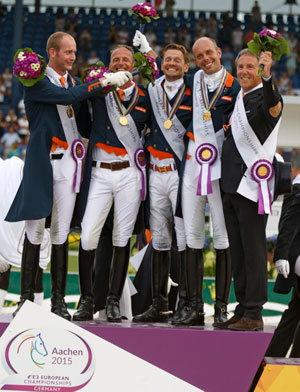 The Netherlands claimed the FEI European Dressage Championships 2015 team title at Aachen, Germany today. On the podium: Diederik van Silfhout, Patrick van der Meer, Edward Gal, Hans Peter Minderhoud and Chef d’Equipe Wim Ernes. Photo by FEI/Dirk Caremans