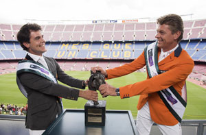 Sydney 2000 Olympic Jumping gold medallist and current World European champion Jeroen Dubbeldam (NED), right, and Sergio Álvarez Moya (ESP) wrestle with the Furusiyya trophy at FC Barcelona’s iconic Camp Nou stadium in the countdown to the Furusiyya FEI Nations Cup™ Jumping Final at the neighbouring Real Club De Polo de Barcelona (September 24-27 ).