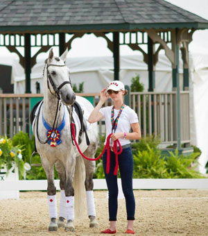 Liza Wilson stepped up at the 2015 North American Junior and Young Rider Championships, acting as a groom, friend, and supporter for friend, Alexandra Meghji and her mount, Iliado II. Photo courtesy of Diana Belevsky