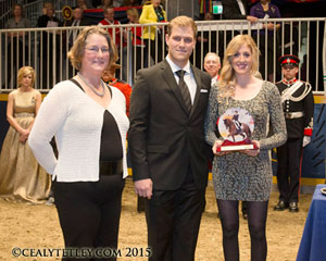 Dressage Canada Chair, Sarah Bradley, presented Brittany Fraser and Marc-Andre Beaulieu with the 2015 Dressage Canada Owner of the Year Award on behalf of Craig Fraser during a special presentation on Nov. 12 at the Royal Horse Show in Toronto, ON. Photo by Cealy Tetley