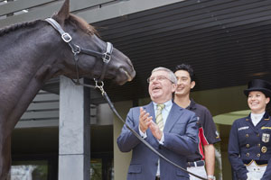 Straight from the horse's mouth: International Olympic Committee President Thomas Bach was greeted at Fédération Equestre Internationale (FEI) Headquarters by the stallion Sarango after meetings with an FEI delegation headed by President Ingmar De Vos and Secretary General Sabrina Zeender. Also pictured are Eventing athlete Alex Hua Tian (CHN) and German Dressage athlete Kristina Bröring-Sprehe. Brazilian Jumping athlete Pedro Veniss (out of shot) also met with the IOC President. Photo by Liz Gregg/FEI