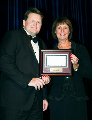 Renowned Canadian course designer Chris Brandt of Oshawa, ON was presented with the 2015 Jump Canada Official of the Year Award by Jump Canada Chair Pamela Law during the Jump Canada Hall of Fame Gala on Nov. 8 in Toronto, ON. Photo by Michelle C. Dunn
