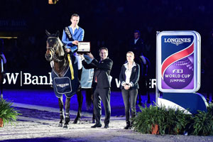 Germany’s Christian Ahlmann and Codex One were presented with a Longines watch by Rainer Eckert, Longines Brand Manager Germany, after winning the fifth leg of the Longines FEI World Cup™ 2015/2016 Western European League at Stuttgart, Germany. Photo by FEI/Karl-Heinz Frieler