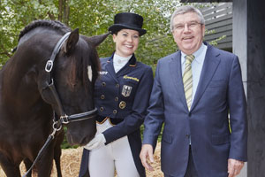 Kristina Bröring-Sprehe (GER), team silver medalist at the London 2012 Olympic Games, is the new world Dressage number one with Desperados FRH. Bröring-Sprehe is pictured here with International Olympic Committee President Thomas Bach during his visit to FEI Headquarters in Lausanne (SUI) last November. Photo by Liz Gregg/FEI