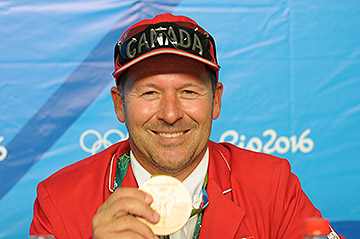 Eric Lamaze posses with his second individual Olympic medal.