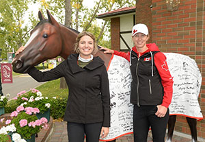 Canada’s Tiffany Foster and Amy Millar pose with the ATCO Energy, Team Canada Cooler.