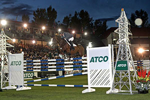 Chris Surbey and Arezzo clear 1.90m in the ATCO Six Bar competition at the Spruce Meadows Masters. Photo by Spruce Meadows Media Services