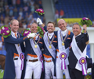 Wim Ernes, Olympic Dressage judge and Dutch team coach, has passed away at the age of 58. He is pictured here (far right) celebrating with (left to right) his gold medal winning team of Diederik van Silfhout, Patrick van der Meer, Edward Gal and Hans Peter Minderhoud at the FEI European Championships 2015 in Aachen (GER). Photo by Arnd Bronkhorst