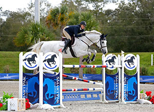 Tracy Fenney and MTM Reve Du Paradis on their way to a $25,000 SmartPak Grand Prix win. Photo by ESI Photography
