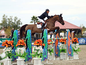 Chris Pratt and Concorde on their way to a $75,000 Purina Animal Nutrition Grand Prix win. Photo by ESI Photography