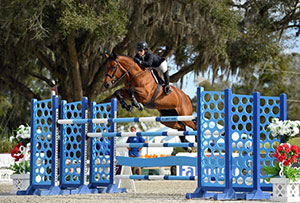 Isabelle Lapierre and Cesha M on their way to a $50,000 HITS Grand Prix win. Photo by ESI Photography