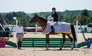 Hilary Donaldson of Leon's making the presentation of awards to Rachel Schnurr and Prince Garbo for their victory of the $25,000 Grand Prix Presented by Leon's. Photo Credit: Ben Radvanyi Photography.