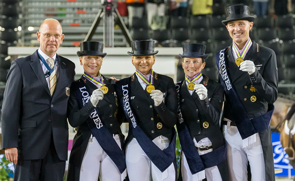 Chef d'Equipe Klaus Roeser (left) with the gold medal winning German Dressage team - Isabell Werth, Dorothee Schneider, Helen Langehanenberg and Sonke Rothenberger - on the podium at the Longines FEI European Championships 2017 in Gothenburg, Sweden. Photo by FEI/Liz Gregg