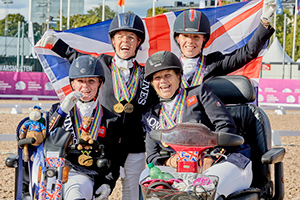 Great Britain take gold in the Para Dressage Team Competition at the Longines FEI European Championships 2017 in Gothenburg, Sweden. From left to right: Susanna Hext (Grade III), Erin Orford (Grade III), Julie Payne (Grade I) and Sophie Wells (Grade V). Photo by FEI/Liz Gregg