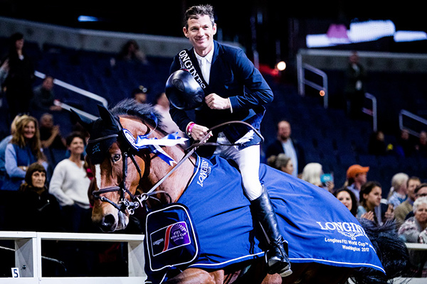 Beat Mändli (SUI) and his mount Dsarie celebrate victory at the Longines FEI World Cup™ Jumping in Washington. Photo by FEI/Ashley Neuhof