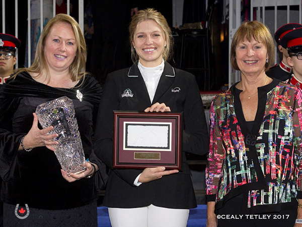 Andy and Carlene Ziegler of Artisan Farms LLC were named the recipients of the 2017 JC Owner of the Year Award for providing world-class horses to the Canadian Show Jumping Team. Tiffany Foster accepted the award from Equestrian Canada (EC) Manager of Sport – Jumping Department, Karen Hendry-Ouellette and EC Jumping Committee Chair, Pam Law on Nov. 8, 2017 at the Royal Horse Show in Toronto, ON. L to R: Karen Hendry-Ouellette, Tiffany Foster, Pam Law. Photo by © Cealy Tetley - www.tetleyphoto.com