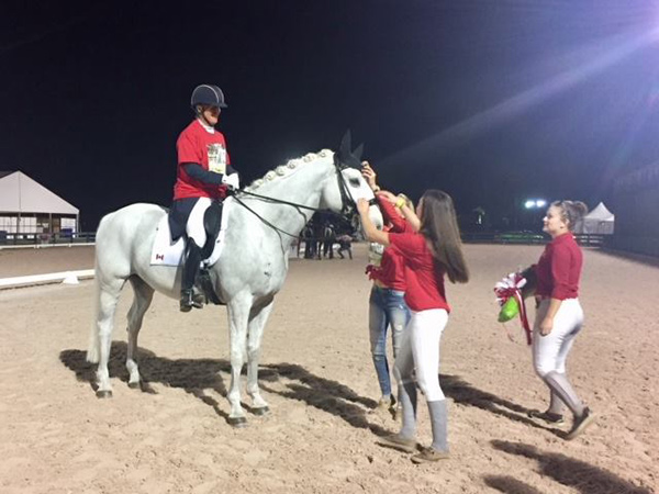 Jacqueline Brooks is given a T-shirt to put on over her tails, and D Niro (aka Goose) is surrounded by Canadian fans at the Adequan Global Dressage Festival.