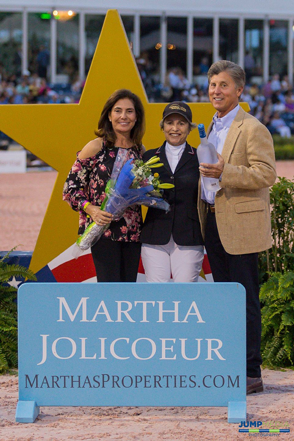 Martha Jolicoeur (left), along with Dr. Stephen Norton (right) present the Martha Jolicoeur Overall Leading Lady Rider Award, in memory of Dale Lawler, to U.S. Olympian Margie Engle at the conclusion of the 2018 Winter Equestrian Festival in Wellington, FL. Photo by Jump Media
