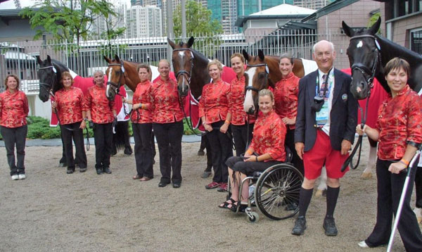 The late Alexander “Sandy” Mitchell of Port Perry, ON, provided several horses to high performance para-dressage athletes over the years, including DonnyMaskell (far right), who was donated to Ashley Gowanlock for the 2008 Beijing Paralympic Games.L to R: Bonnie Brown, Eleonore Elstone, Sharon Burton, Karen Brain, Sandra Verda, Jennifer McKenzie, Andrea Taylor, Alice Beatty, Lauren Barwick, Sandy Mitchell, Ashley Gowanlock Photo © Equestrian Canada