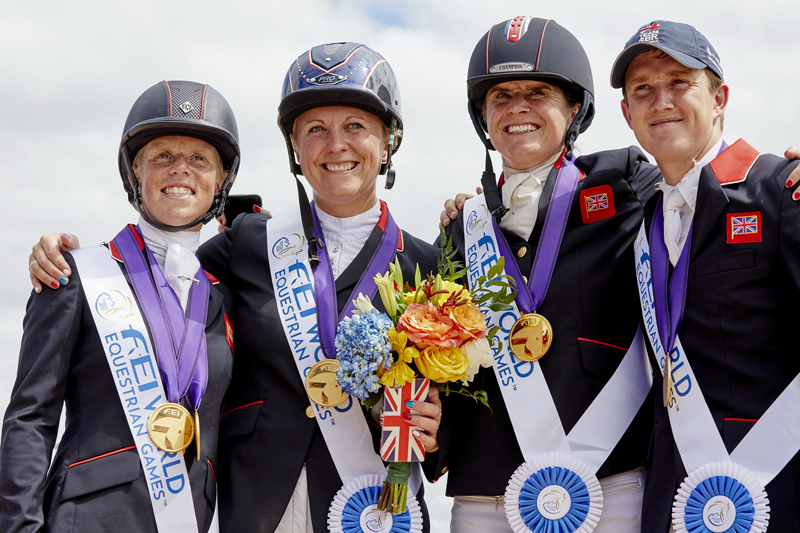 That winning feeling! Team GB stand tall, as they take gold to secure the World Title in the Mars Eventing Team competition at the FEI World Equestrian Games™ Tryon 2018, as well as a ticket to Tokyo 2020 Olympic Games. (FEI/Liz Gregg)