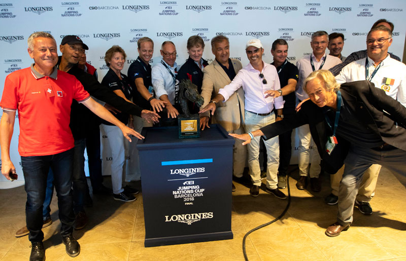 They all want to get their hands on it! The Chefs d’Equipe of the 15 nations that will compete for the 2018 Longines FEI Jumping Nations Cup™ title when the action gets underway at 20.00 tomorrow evening at the Real Club de Polo in Barcelona (ESP). Photo by FEI/Jim Hollander