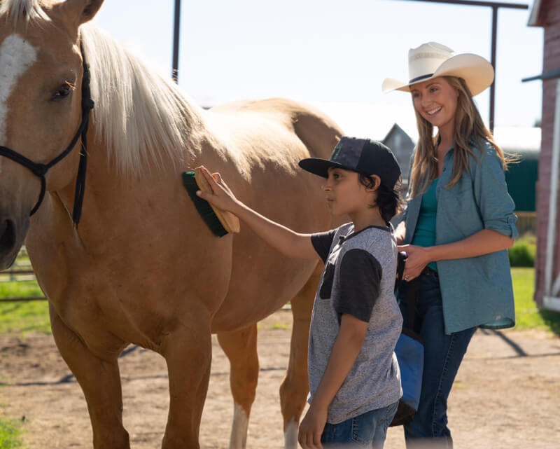 Heartland newcomer Lucian-River Chauhan, on set with star Amber Marshall.Photo by Andrew Bako