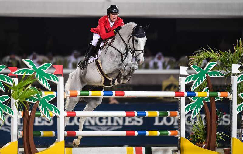 Sven Schlüsselburg and his grey gelding Bud Spencer picked up just a single time fault in both rounds to help Team Germany to victory at today’s Longines FEI Jumping Nations Cup™ of the United Arab Emirates in Abu Dhabi (UAE). Photo by FEI/Martin Dokoupil