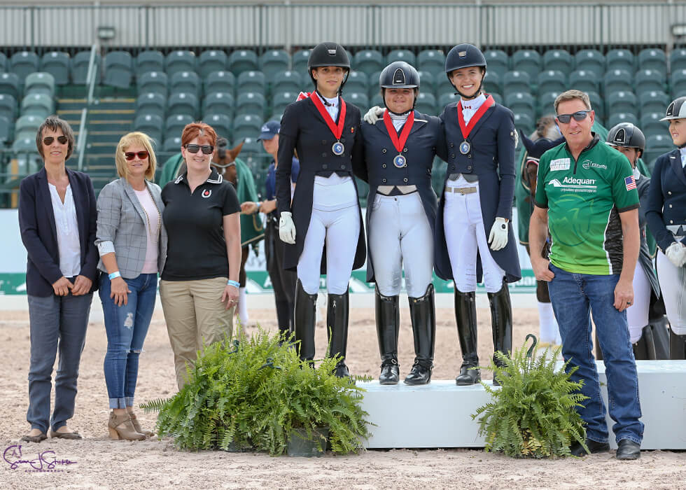 Team Canada 1 – comprised of Naima Moreira Laliberté of Outremont, QC, Laurence Blais Tètreault of Montreal, QC, and Tanya Strasser-Shostak of Sainte-Adèle, QC – claimed the silver medal in the Nations Cup CDIO-U25 presented by Diamante Farms, held March 13, 2019, in Wellington, FL. L to R: Isabelle Judet, Terri Kane, Christine Peters, Moreira Laliberté, Strasser-Shostak, Blais Tètreault, Allyn Mann.