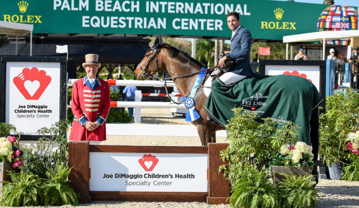 Daniel Bluman claimed first place aboard Colestina H in the $72,000 Joe DiMaggio Children's Health Specialty Center 1.50m Qualifier. Pictured with ring master, Steve Rector. (©ESP)