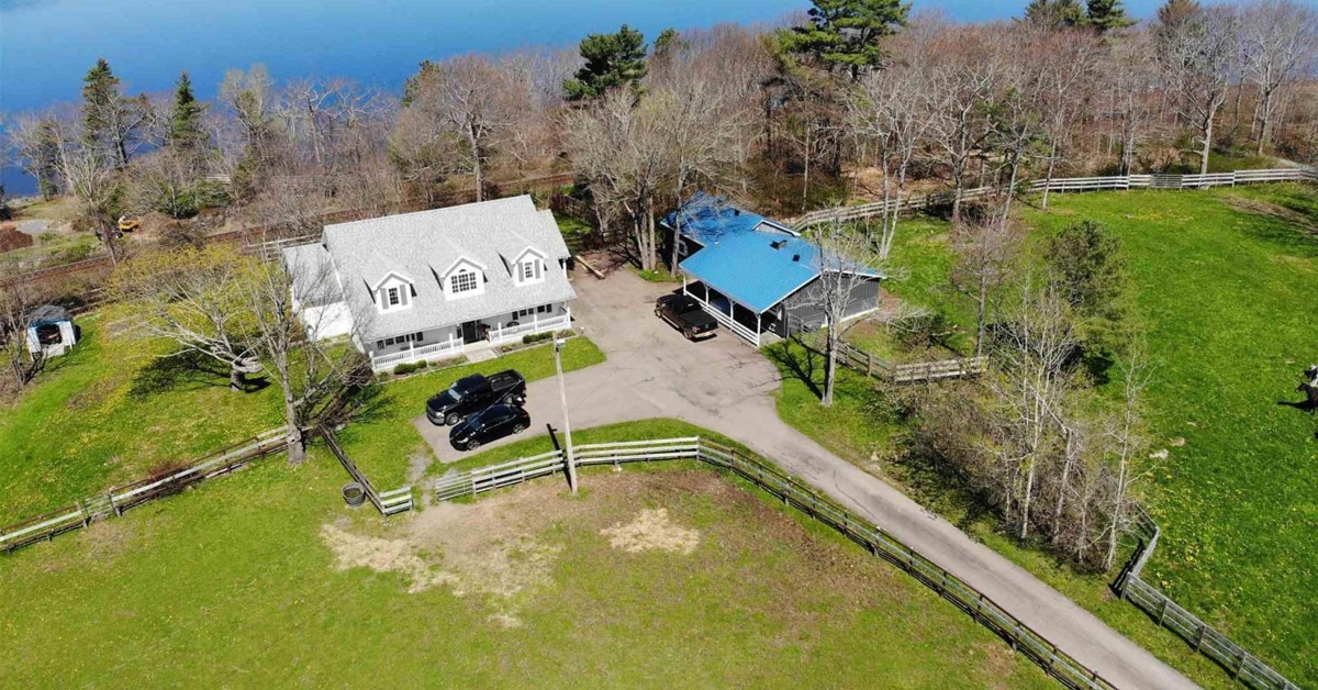 Thumbnail for $1,100,000 for a Cape Cod-style home with barn and lake access in Grand Lake, NS
