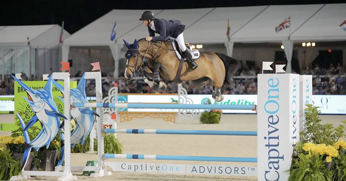 McLain Ward and Quimi del Maset jumping a fence at WEF.
