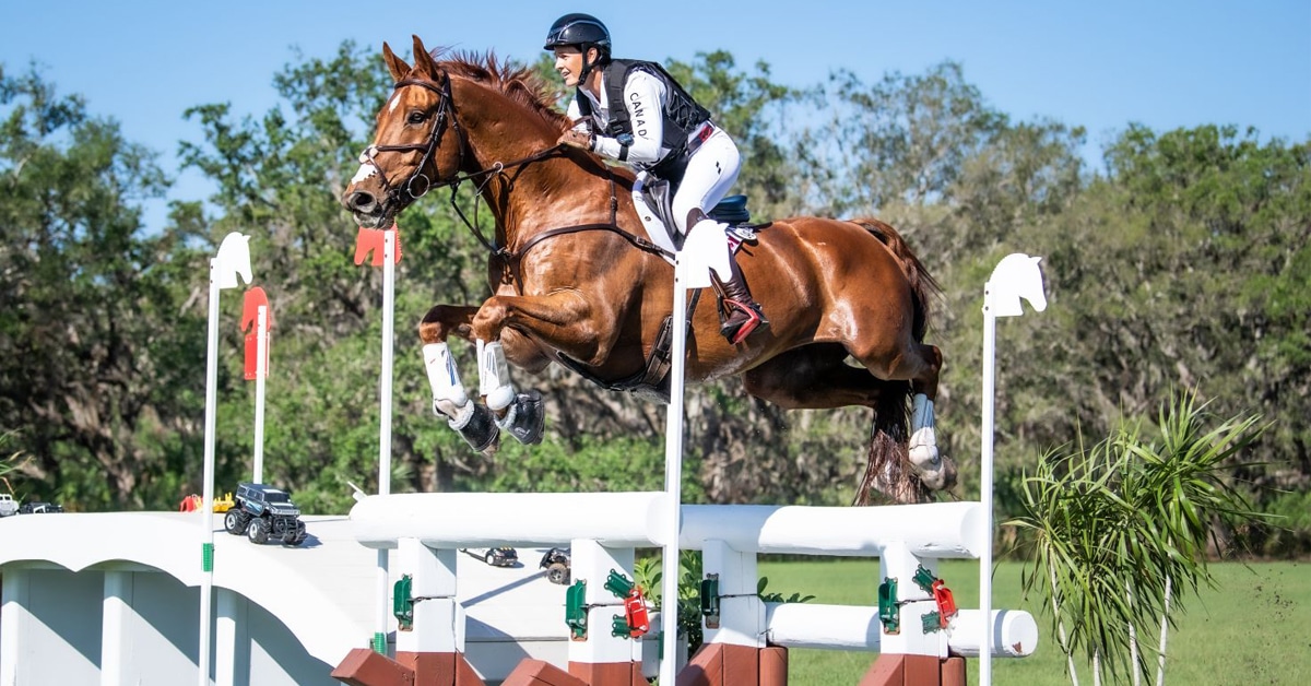 Colleen Loach and Vermont jumping a cross-country fence at Terranova.