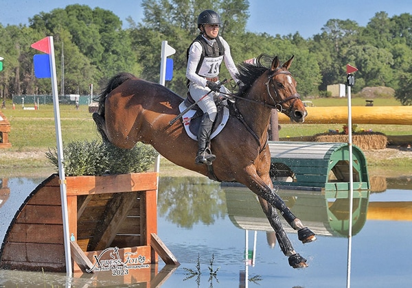 Jessica Phoenix and Freedom GS navigating a water jump.