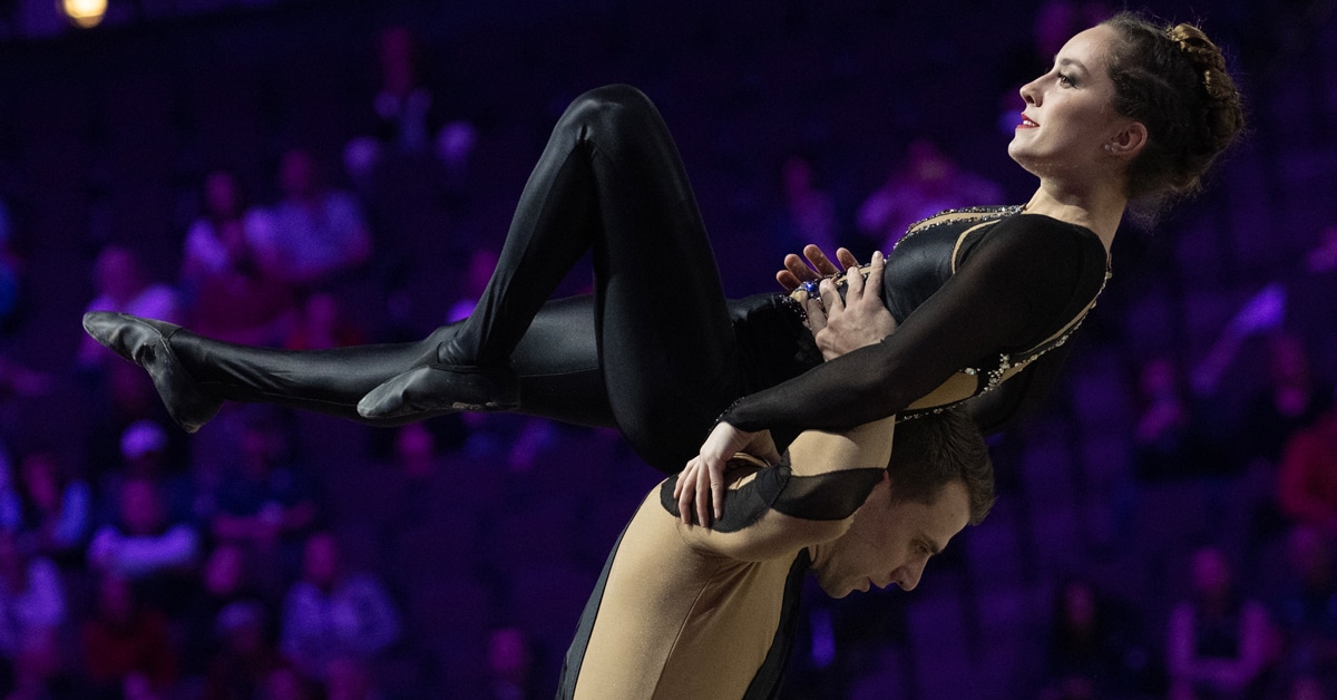 Chiara Congia and Justin Van Gerven performing a vaulting move.