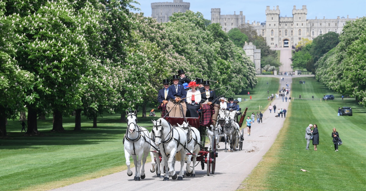 Horse-drawn carriages in front of Windsor castle.